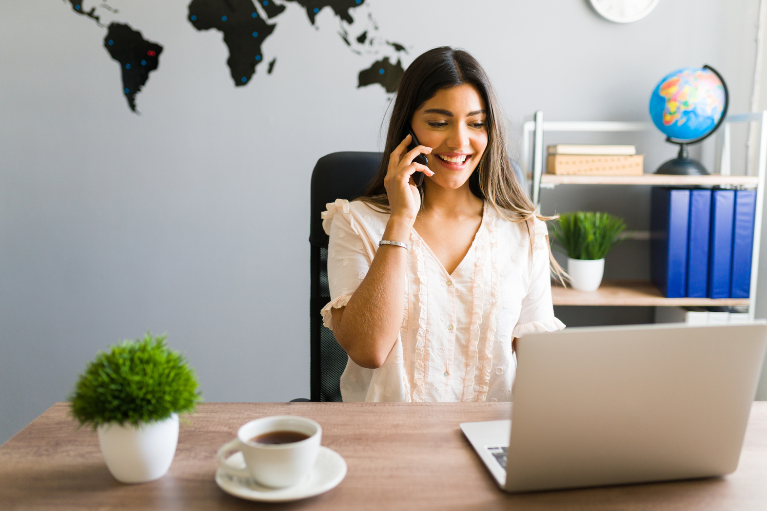 Happy travel agent booking a vacation tour
